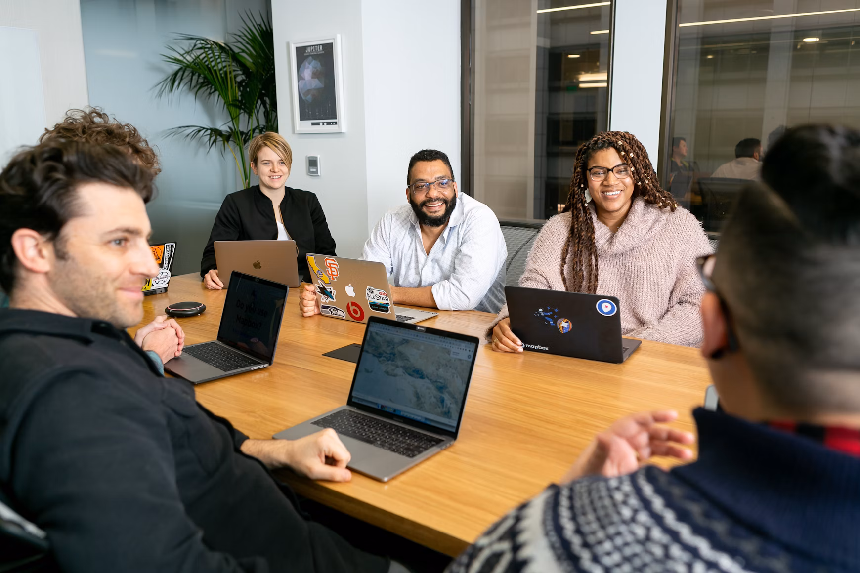 Collaborative team at Maximum Labs discussing AI and Data Science solutions